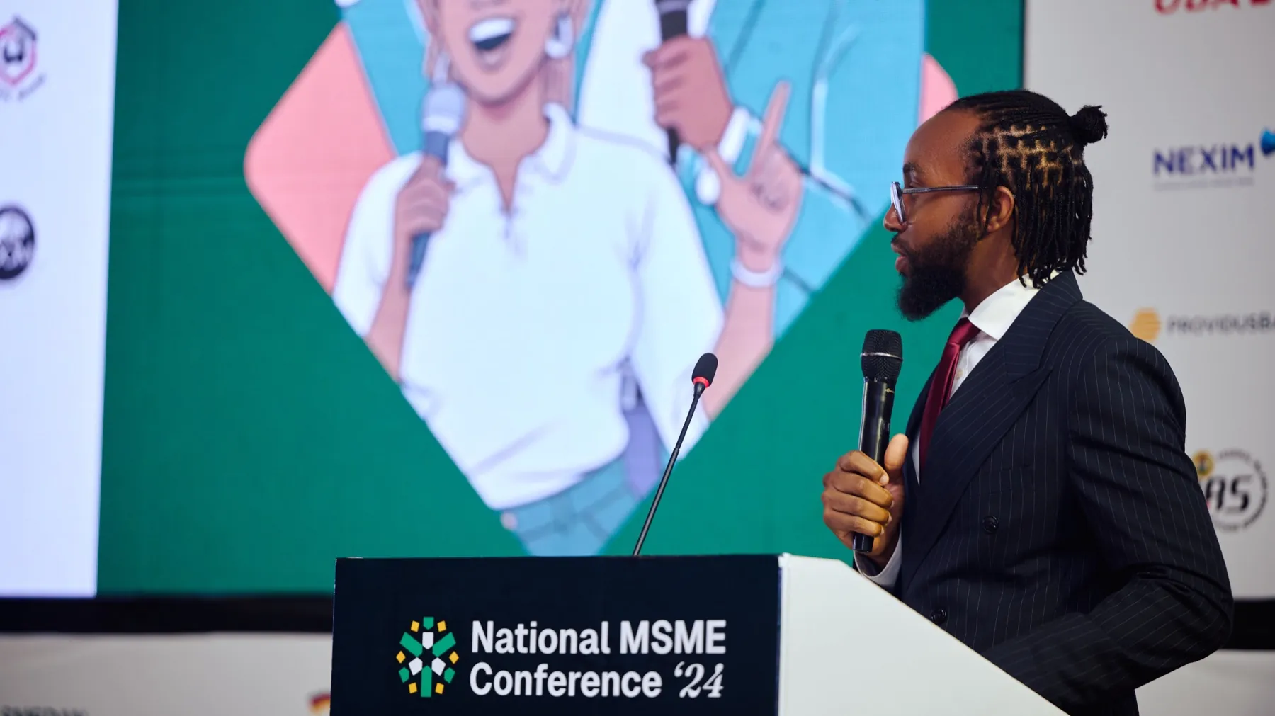 David ’Tobi Oyawoye at the National MSME Conference ’24 lectern, microphone in hand