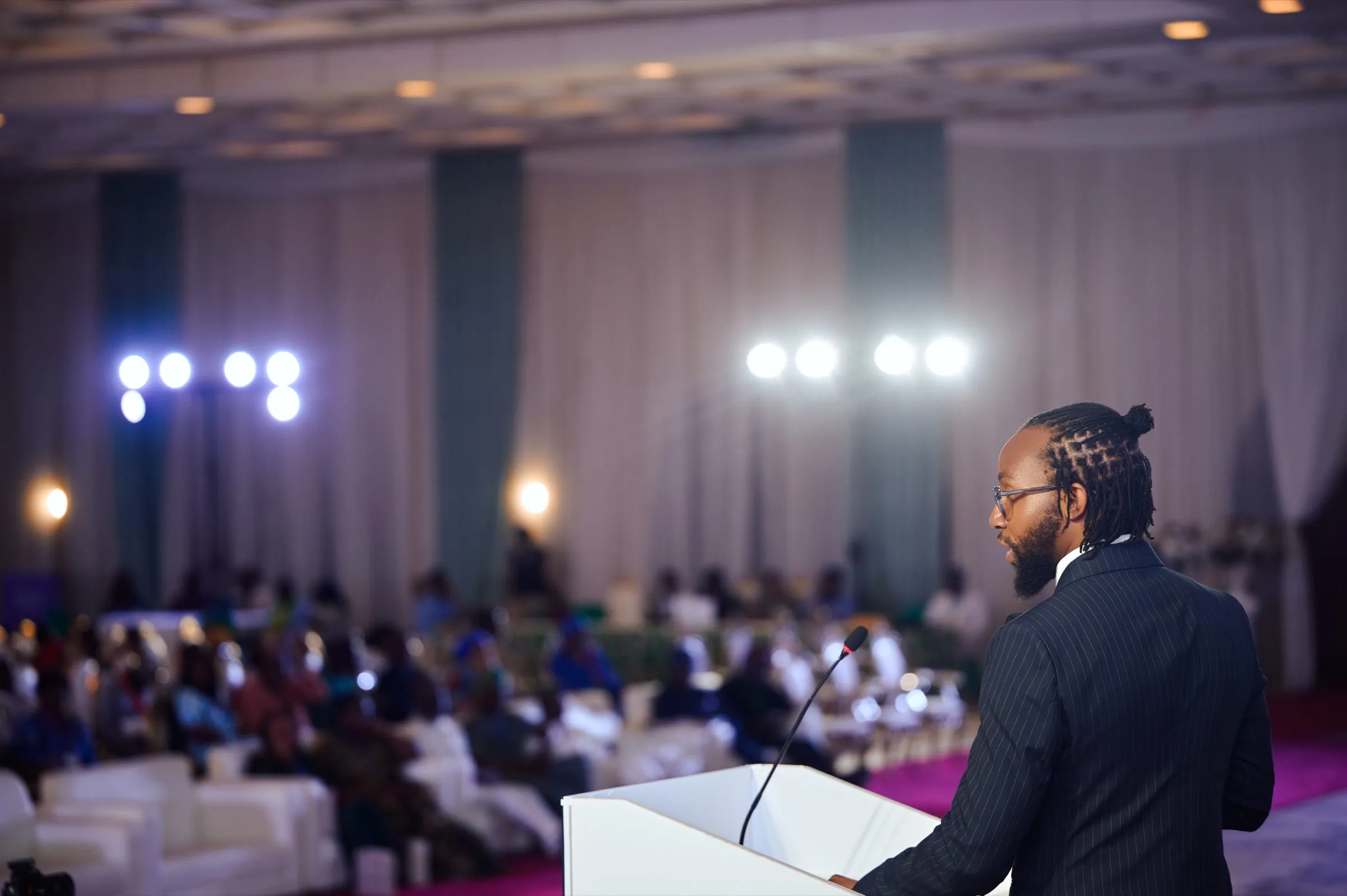 David ’Tobi Oyawoye on stage, moderating the pitch competition