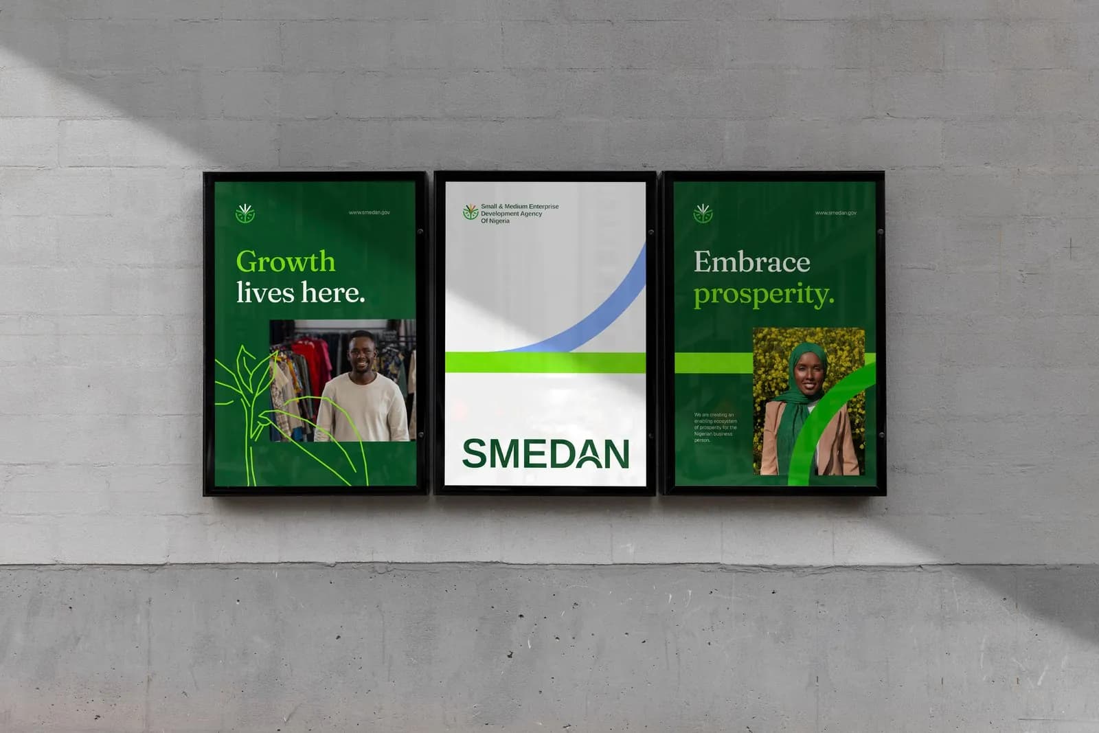 Three SMEDAN posters on a wall: Growth lives here, the SMEDAN wordmark, Embrace prosperity