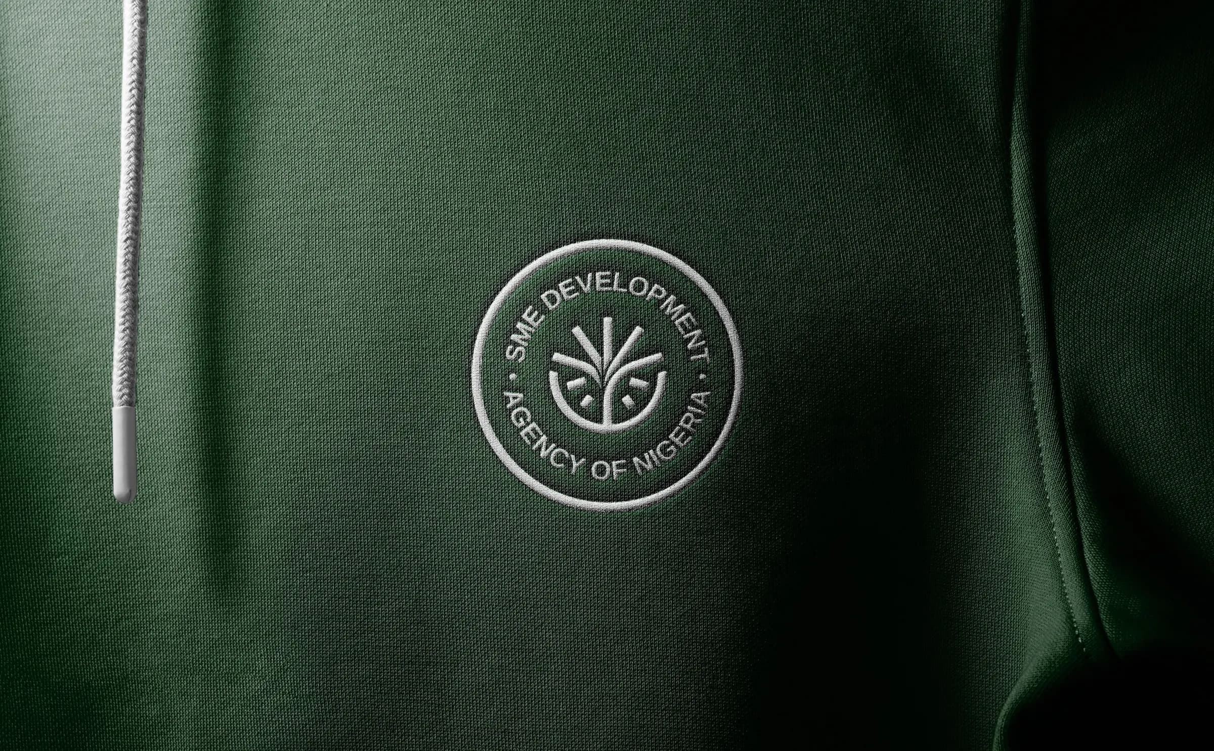 The SMEDAN seal embroidered on a green hoodie